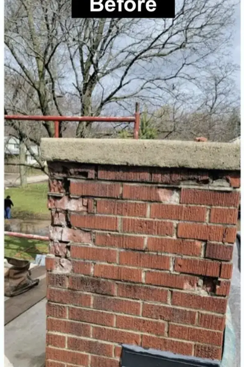 Chimney before repair: cracked and spalling brick with deteriorated mortar joints
